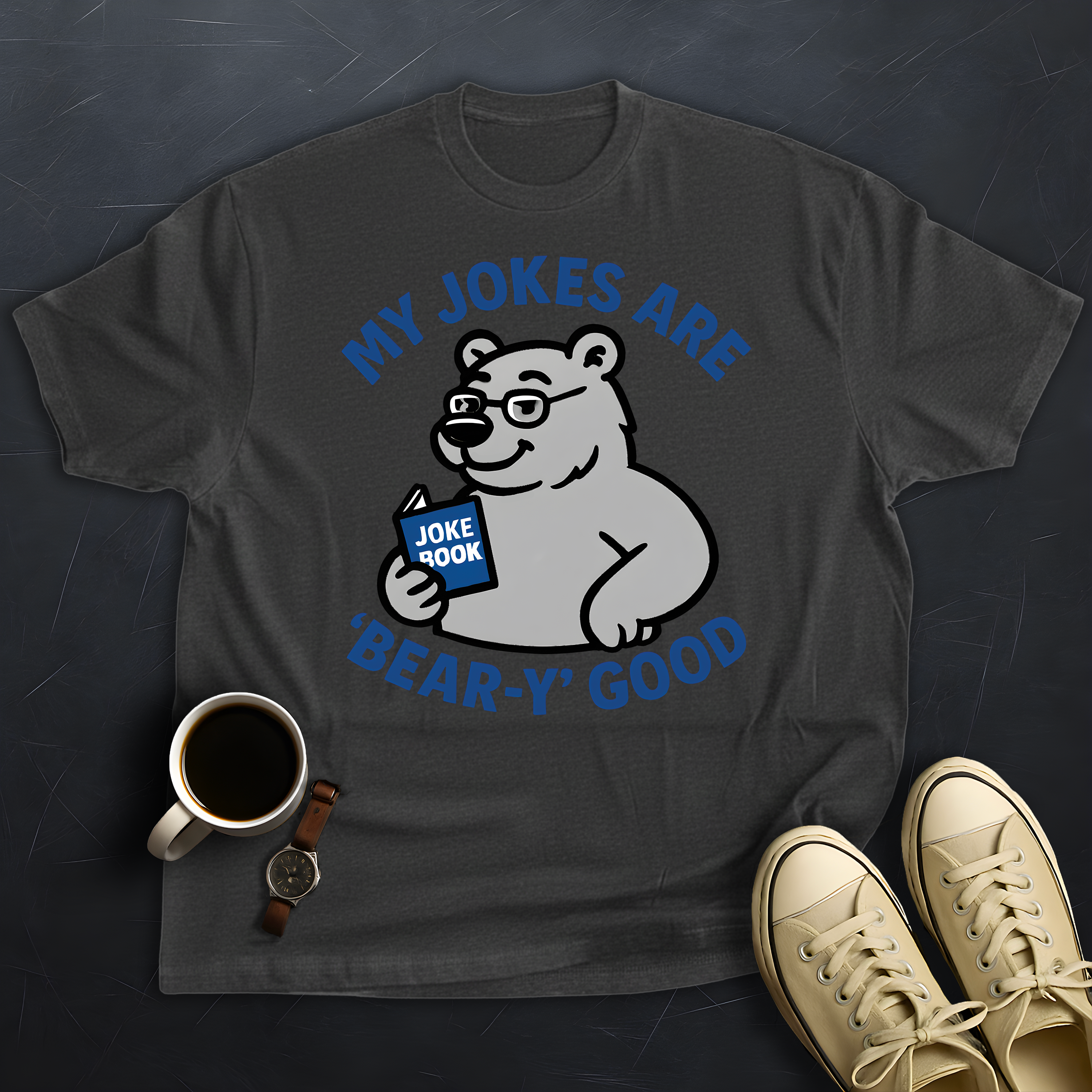 Gray t-shirt with bear graphic and text 'My jokes are bear-y good' on a dark textured background.